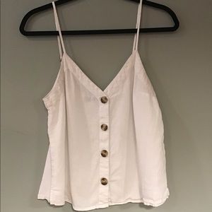 White cami with tortoise colored buttons